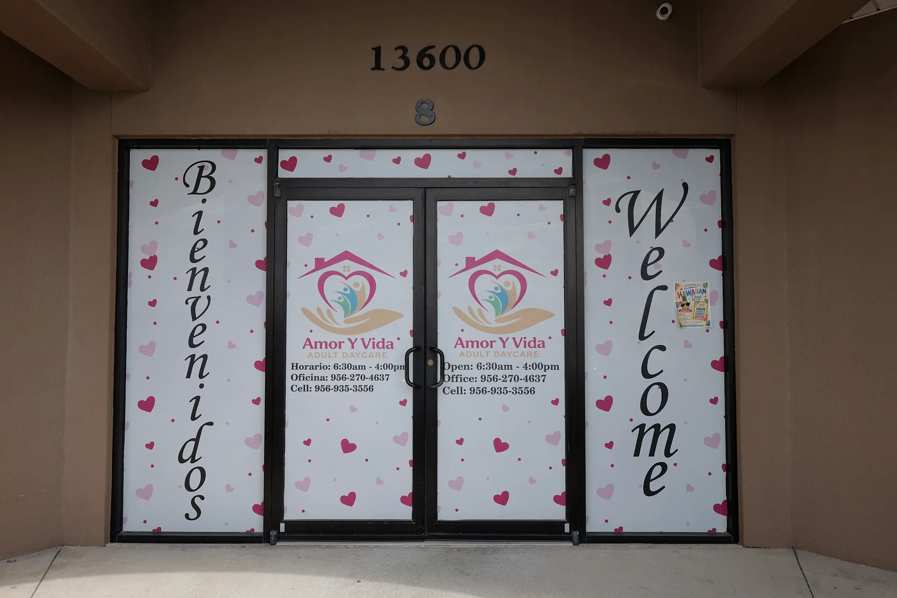 The front entrance on Hwy 107, with hours and phone numbers on the door
