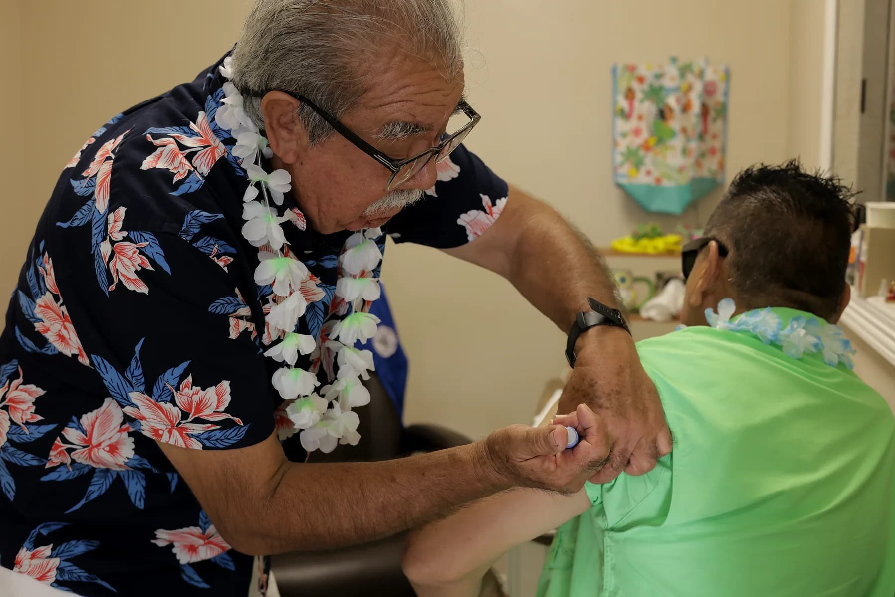 A staff member checking on a participant during the daily wellness round