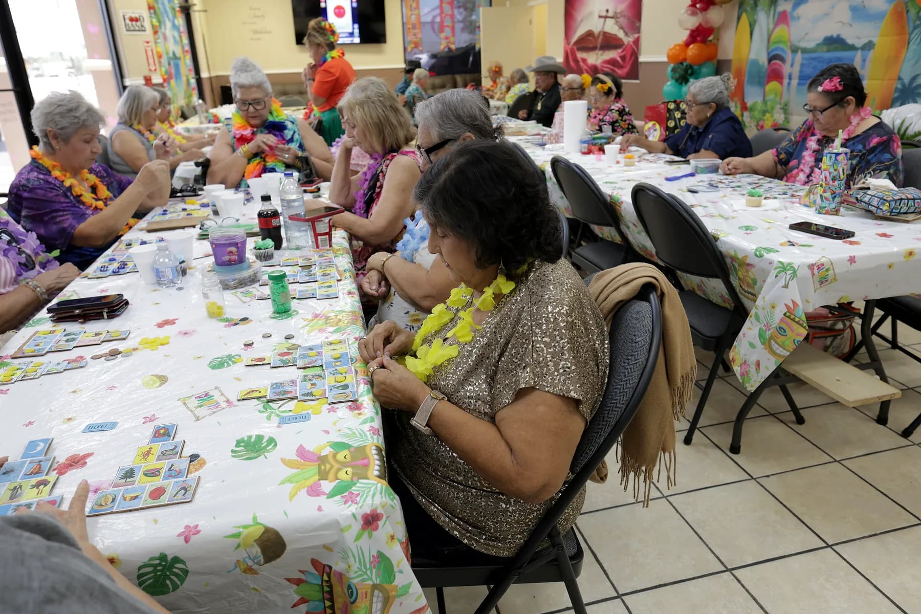 The long table mid-game, boards and markers spread across it