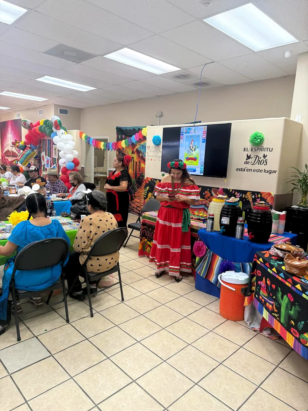 A dancer in traditional folklorico dress at the grand opening celebration