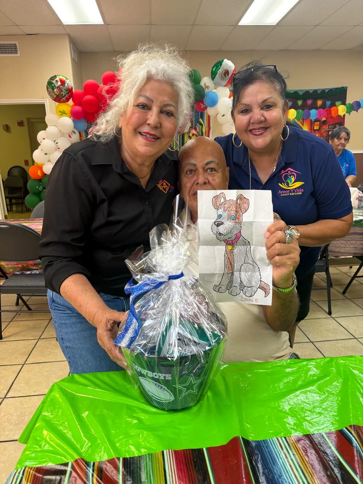A participant with the gift basket he won at the grand opening raffle