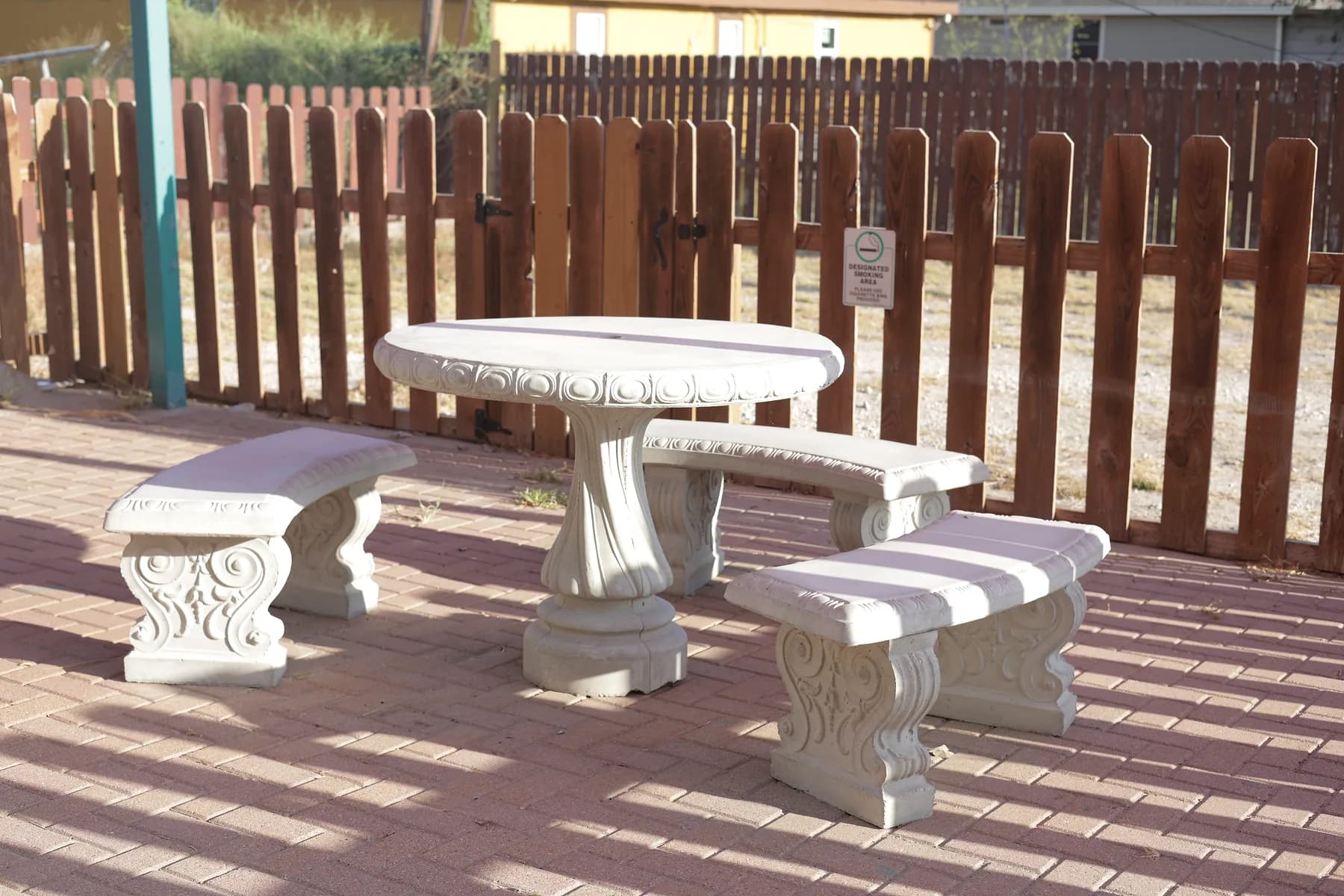 The shaded outdoor seating area in the center's fenced patio